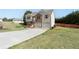 Charming home with a well-maintained lawn, a two-car garage, and classic architecture at 7235 Magnolia Ln, Fairburn, GA 30213