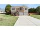 Charming two-story home featuring a brick facade, two-car garage, and well-maintained lawn at 7235 Magnolia Ln, Fairburn, GA 30213