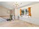Foyer space featuring a large window and a view of the staircase at 7235 Magnolia Ln, Fairburn, GA 30213