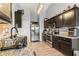 Kitchen showcasing stainless steel appliances, granite counters, and stylish black cabinetry at 7235 Magnolia Ln, Fairburn, GA 30213