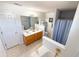 Bathroom offers a double sink vanity, a large mirror, toilet, and separate shower and tub at 226 Saul Dr, Ellenwood, GA 30294