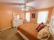 Bedroom featuring carpeted floors, a ceiling fan, neutral walls, and a white dresser at 226 Saul Dr, Ellenwood, GA 30294