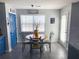 Charming breakfast nook with a round table, seating for four, and natural light streaming through the window at 226 Saul Dr, Ellenwood, GA 30294