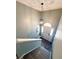 Elegant entryway features a pendant light, arched window door, and stylish tile floor at 226 Saul Dr, Ellenwood, GA 30294