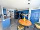 Cozy kitchen showcasing blue cabinets, granite countertops, and an adjacent breakfast nook at 226 Saul Dr, Ellenwood, GA 30294