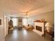 Inviting living room featuring brick fireplace, decorative ceiling, neutral paint, built-in bookcase, and large windows at 226 Saul Dr, Ellenwood, GA 30294