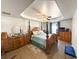 Spacious main bedroom boasts a tray ceiling, ceiling fan, and a gorgeous four-poster bed at 226 Saul Dr, Ellenwood, GA 30294
