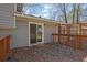Back deck of home with wood railing and sliding glass door at 4391 Shiloh Hills Dr, Snellville, GA 30039