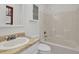 Bathroom featuring a vanity, toilet, and a shower-tub combo at 4391 Shiloh Hills Dr, Snellville, GA 30039