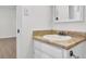 Bathroom featuring vanity with decorative countertop and updated fixtures at 4391 Shiloh Hills Dr, Snellville, GA 30039