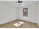 Neutral-toned bedroom featuring a ceiling fan, wood-look floors and a window at 4391 Shiloh Hills Dr, Snellville, GA 30039