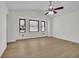 Bedroom with vaulted ceiling, wood-look floors, and windows with shades at 4391 Shiloh Hills Dr, Snellville, GA 30039