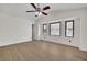 Bedroom with vaulted ceiling, wood-look floors, and triple windows with shades at 4391 Shiloh Hills Dr, Snellville, GA 30039