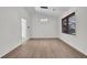 Dining room with hardwood floors, a modern light fixture, and a bright window at 4391 Shiloh Hills Dr, Snellville, GA 30039