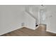 Bright entryway with hardwood floors, leading to a staircase and featuring a modern front door at 4391 Shiloh Hills Dr, Snellville, GA 30039
