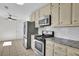 Kitchen featuring stainless steel appliances, subway tile backsplash, and plenty of cabinet space at 4391 Shiloh Hills Dr, Snellville, GA 30039