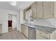 Bright kitchen with stainless steel appliances, white subway tile backsplash, and light-colored cabinets at 4391 Shiloh Hills Dr, Snellville, GA 30039