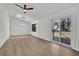 Large living room with a ceiling fan, hardwood floors, a sliding glass door, and recessed lighting at 4391 Shiloh Hills Dr, Snellville, GA 30039