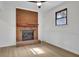 Charming living room with a brick fireplace, new floors, natural light and a ceiling fan at 4391 Shiloh Hills Dr, Snellville, GA 30039
