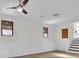 Cozy living room with new flooring, white walls and a ceiling fan at 4391 Shiloh Hills Dr, Snellville, GA 30039