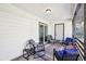 Inviting covered back porch with comfortable seating and ample space to relax outdoors at 8 Pine Canyon Sw Dr, Atlanta, GA 30331