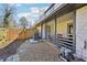 Covered back porch, perfect for relaxing and entertaining with easy access to the backyard at 8 Pine Canyon Sw Dr, Atlanta, GA 30331