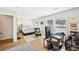 Spacious bedroom featuring a large bed, wood floors, and a dedicated workspace with natural light at 8 Pine Canyon Sw Dr, Atlanta, GA 30331