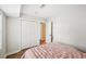 Bedroom featuring a closet, access to another room, and wood floors for a contemporary look at 8 Pine Canyon Sw Dr, Atlanta, GA 30331
