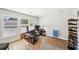 Bedroom featuring a work area with natural light, modern furniture, and wood floors at 8 Pine Canyon Sw Dr, Atlanta, GA 30331