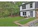 Charming two-story home featuring a well-manicured lawn and fresh, modern paint at 8 Pine Canyon Sw Dr, Atlanta, GA 30331
