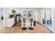 Updated kitchen featuring stainless steel appliances, granite counters, and access to patio at 8 Pine Canyon Sw Dr, Atlanta, GA 30331
