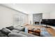 Living room featuring a cozy fireplace, hardwood floors, and windows for natural light at 8 Pine Canyon Sw Dr, Atlanta, GA 30331