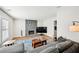 Living room features stone fireplace, hardwood flooring, and neutral paint at 8 Pine Canyon Sw Dr, Atlanta, GA 30331