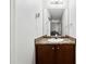 Compact bathroom features a vanity, sink, faucet, mirror, and modern light fixture at 1042 Wedgewood Ct, Conyers, GA 30012
