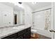 The bathroom includes vanity with a sink, mirror, and a shower-tub combination at 1042 Wedgewood Ct, Conyers, GA 30012