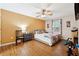 A well-lit bedroom features a large window, neutral walls, and a comfortable king-size bed at 1042 Wedgewood Ct, Conyers, GA 30012