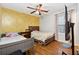 A cheerful bedroom features two beds, a desk area, and wood flooring at 1042 Wedgewood Ct, Conyers, GA 30012
