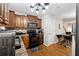 A charming kitchen boasts wooden cabinets, modern appliances, and an adjacent breakfast bar area at 1042 Wedgewood Ct, Conyers, GA 30012