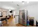 Open concept kitchen with stainless steel appliances, wooden cabinets, and an island at 1042 Wedgewood Ct, Conyers, GA 30012