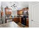 Modern kitchen featuring stainless steel appliances, wood cabinets, and sleek countertops at 1042 Wedgewood Ct, Conyers, GA 30012
