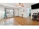 Inviting living room featuring hardwood floors, a ceiling fan, and a well-lit interior at 1042 Wedgewood Ct, Conyers, GA 30012