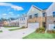 New townhomes line the street, each boasting unique brick and siding exteriors, and inviting curb appeal at 5769 Tillman Way, Powder Springs, GA 30127