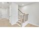Bright hallway with stairs and views of the front yard at 5769 Tillman Way, Powder Springs, GA 30127