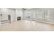 Bright living room with fireplace, hardwood floors, and access to the outdoor patio at 5769 Tillman Way, Powder Springs, GA 30127