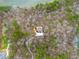 Stunning aerial view of a secluded home nestled in lush woods by the water at 30 Crolley Ln, White, GA 30184
