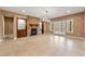 Basement area with a stone fireplace, built-in cabinets, and french doors at 30 Crolley Ln, White, GA 30184