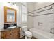 Charming bathroom with a vanity, decorative mirror, tub and shower combo with subway tile surround at 30 Crolley Ln, White, GA 30184