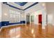Open floor plan featuring hardwood floors, blue wainscotting, and an arched doorway at 30 Crolley Ln, White, GA 30184