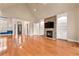 Living room featuring a stone fireplace, hardwood floors, and an open layout at 30 Crolley Ln, White, GA 30184