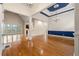 Expansive living room featuring hardwood floors, tall ceilings, columns, and a walkout balcony at 30 Crolley Ln, White, GA 30184